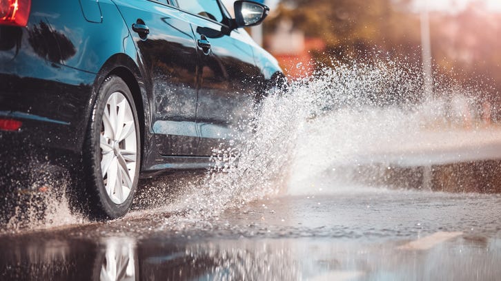 Strong storm floods streets, freeways, but brings less rain than expected