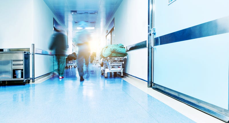 Doctors or nurses walking in hospital hallway