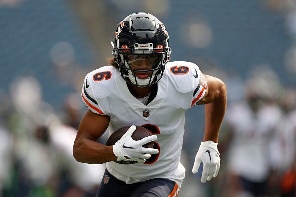 Kyler Gordon models the white tops/blue pants uniform combination that the Bears utilize. 