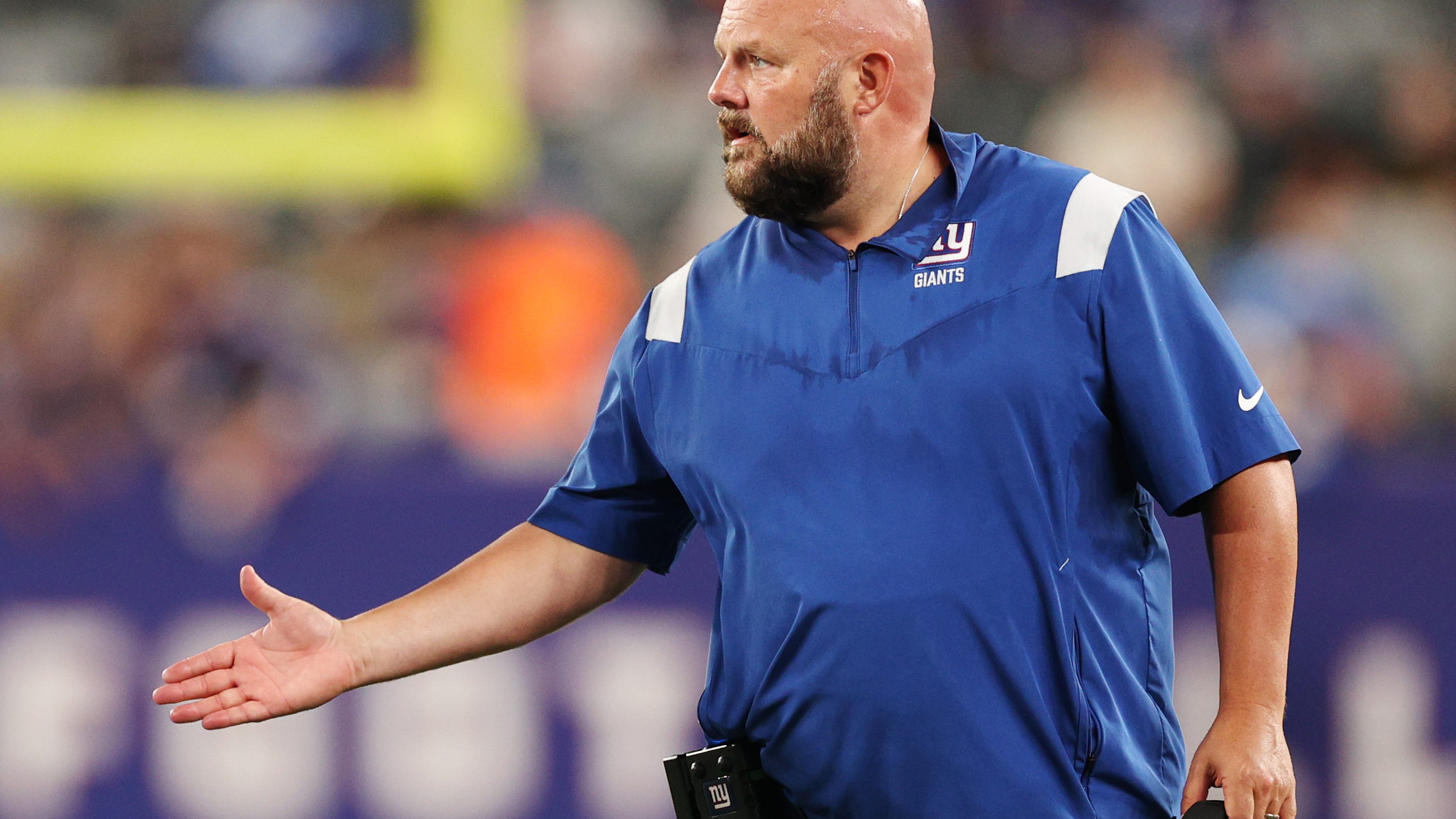 Giants coach Brian Daboll smoked a victory cigar while celebrating with fans