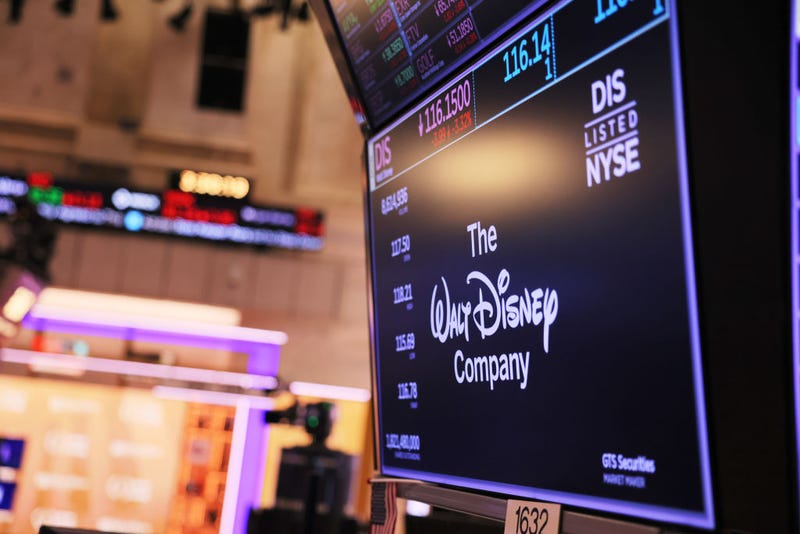 The Walt Disney company logo is displayed as traders work on the floor of the New York Stock Exchange during afternoon trading on August 22, 2022 in New York City.