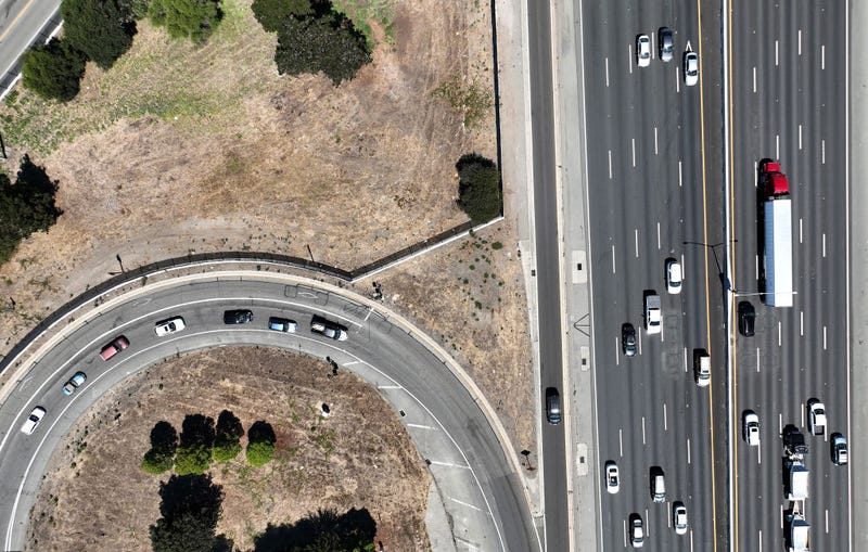 In an aerial view, traffic moves along Interstate 80 on August 24, 2022 in Berkeley, California. California is set to implement a plan to prohibit the sale of new gasoline-powered cars in the state by 2035 in an effort to fight climate change by transitioning to electric vehicles. (Photo by Justin Sullivan/Getty Images)