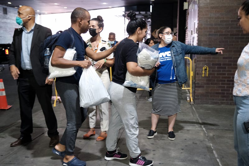 Migrants who crossed the border from Mexico into Texas exit a bus as it arrives into the Port Authority bus station in Manhattan on August 25, 2022 in New York City. Numerous buses from Texas filled with migrants have been arriving into New York City every few days since early August as Texas Governor Greg Abbott continues to be at odds with New York City Eric Adams about border policies. The hundreds of migrants have been welcomed into the city and given temporary shelter as authorities try to find more permanent arrangements.