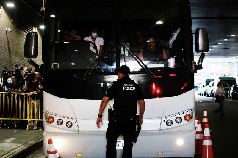 A bus carrying migrants who crossed the border from Mexico into Texas arrives into the Port Authority bus station in Manhattan on August 25, 2022 in New York City.