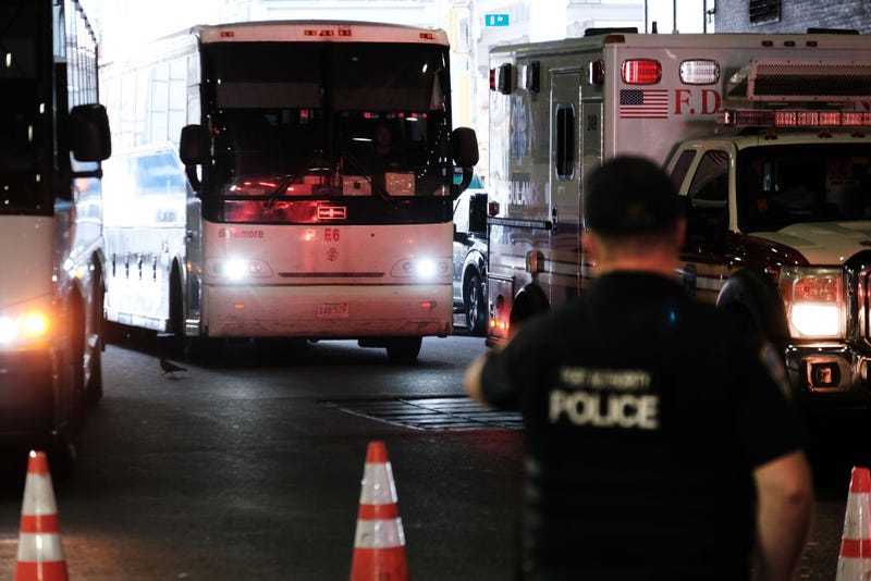 A bus carrying migrants who crossed the border from Mexico into Texas arrives into the Port Authority bus station in Manhattan on August 25, 2022 in New York City.