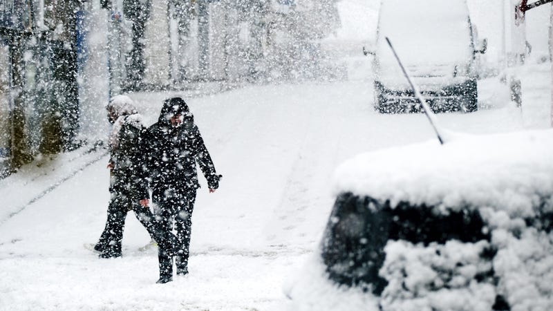 People walking in heavy snow