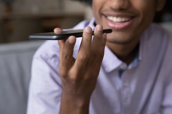Man talking on speakerphone