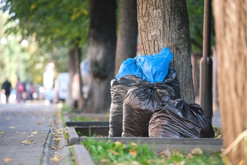 black garbage bags on curbside