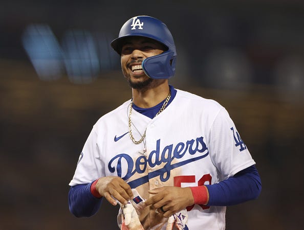 Mookie Betts models the Dodgers home uniforms.