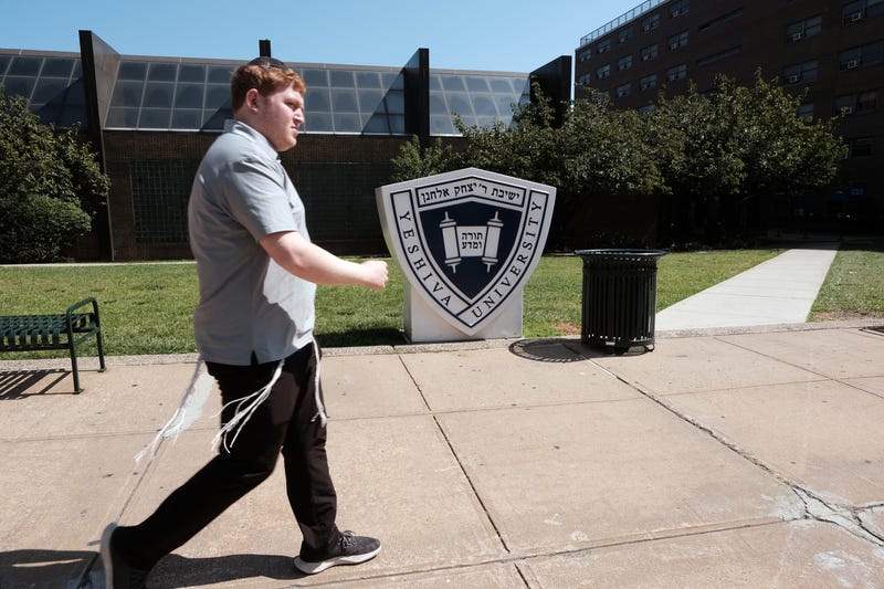 People walk by the campus of Yeshiva University in New York City on August 30, 2022 in New York City. Yeshiva University had filed an emergency request with the Supreme Court asking it to block a judge’s order that requires the university to recognize an LGBTQ+ student group. The religious and Jewish university stated in court papers that “Yeshiva cannot comply with that order because doing so would violate its sincere religious beliefs about how to form its undergraduate students in Torah values."