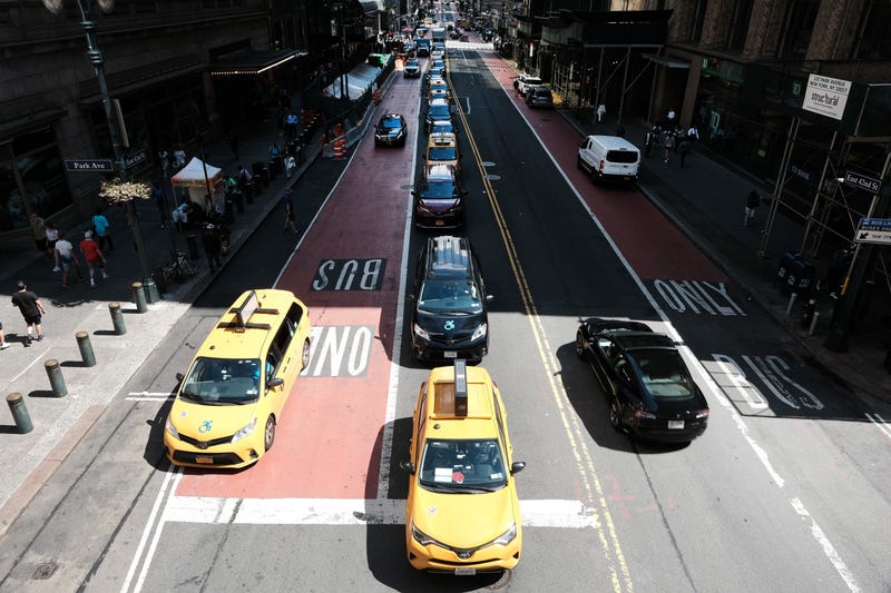 Traffic moves through midtown Manhattan in New York City. A proposed congestion pricing plan in New York City to reduce traffic has attracted hundreds of New Yorkers to a series of public hearings on the matter. 