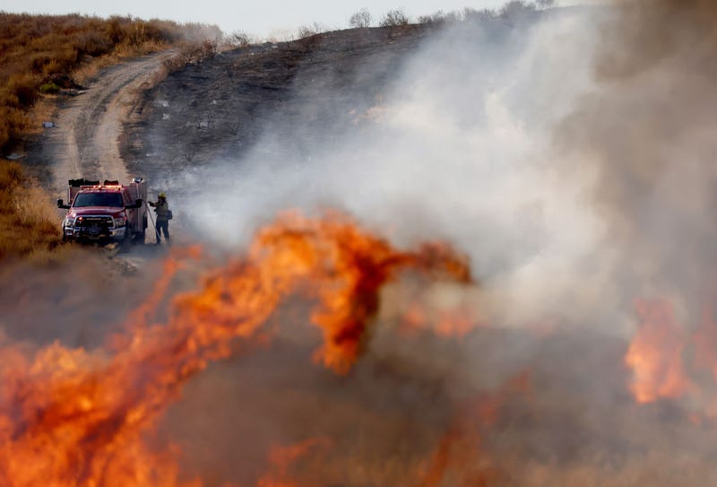 A firefighter works as the Route Fire burns on August 31, 2022, near Castaic, California.