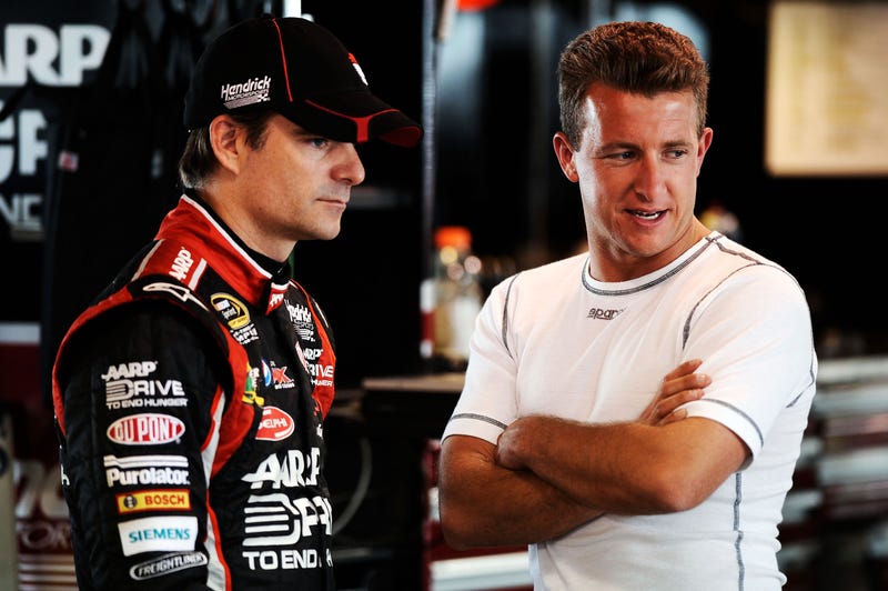 Jeff Gordon, driver of the #24 Drive to End Hunger Chevrolet, talks to AJ Allmendinger, driver of the #22 Shell/Pennzoil Dodge, during practice for the NASCAR Sprint Cup Series Goody's Fast Relief 500 at Martinsville Speedway on March 30, 2012 in Martinsville, Virginia.