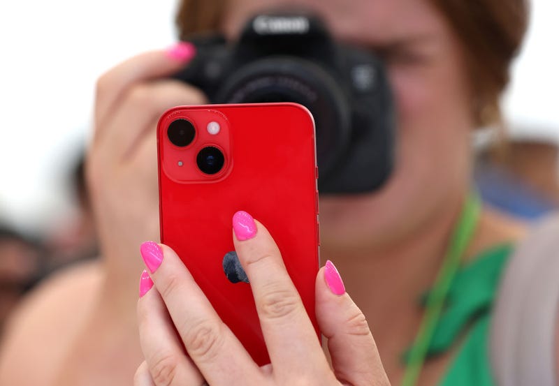An attendee takes a photo of a new iPhone 14 during an Apple special event on September 07, 2022 in Cupertino, California. Apple CEO Tim Cook unveiled the new iPhone 14 as well as new versions of the Apple Watch, including the Apple Watch SE, a low-cost version of the popular timepiece that will start at $249. (Photo by Justin Sullivan/Getty Images)