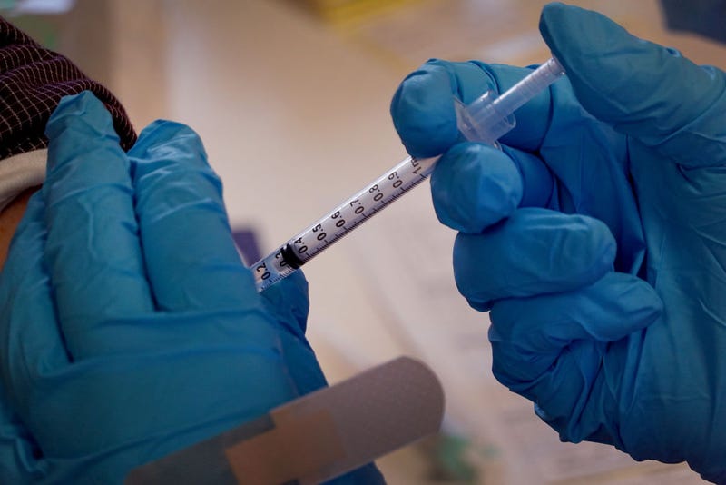 A pharmacist gives a COVID-19 vaccine booster shot during an event hosted by the Chicago Department of Public Health at the Southwest Senior Center on September 09, 2022 in Chicago, Illinois. 