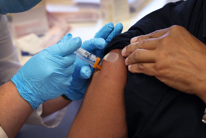 A resident receives a pneumonia vaccine during an event hosted by the Chicago Department of Public Health at the Southwest Senior Center on September 09, 2022 in Chicago, Illinois.