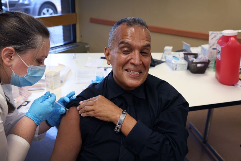 Felipe Sanchez gets a COVID-19 booster shot from pharmacist Patricia Pernal during an event hosted by the Chicago Department of Public Health at the Southwest Senior Center on September 09, 2022 in Chicago, Illinois.