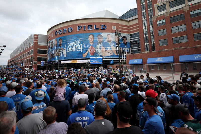 Lions fans gather outside of Ford Field in Downtown Detroit
