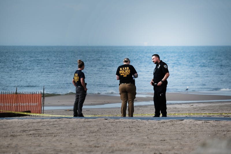 Police work along a stretch of beach at Coney Island which is now a crime scene after a mother is suspected of drowning her children in the ocean on September 12, 2022 in Brooklyn