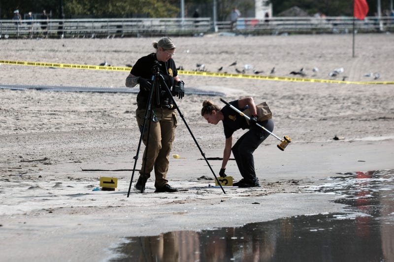 Police work along a stretch of beach at Coney Island which is now a crime scene after a mother is suspected of drowning her children in the ocean on September 12, 2022 in Brooklyn