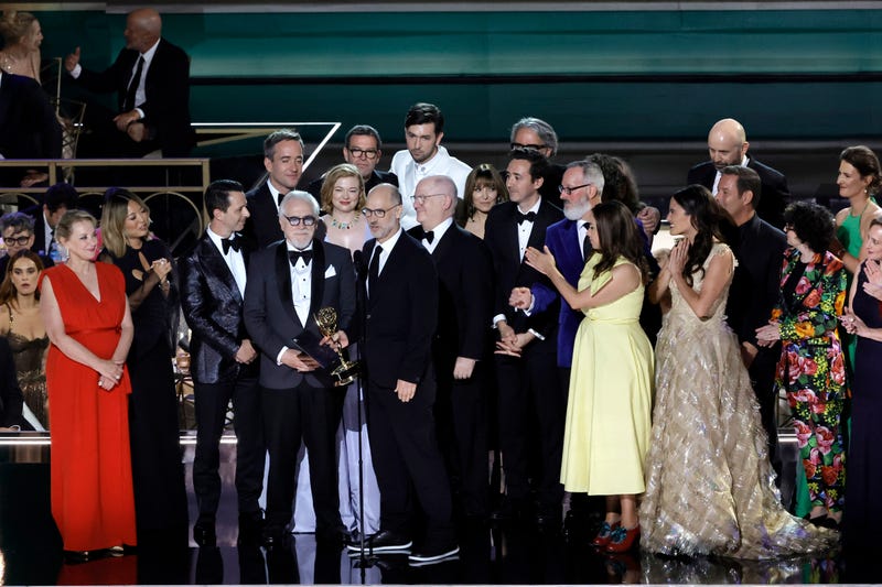 Jesse Armstrong (C, holding trophy) and cast and crew of 'Succession' accept the Outstanding Drama Series award onstage during the 74th Primetime Emmys at Microsoft Theater on September 12, 2022 in Los Angeles, California.