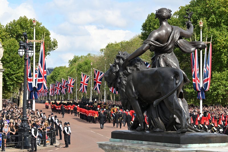 The Queen’s funeral cortege makes its way along The Mall from Buckingham Palace during the procession for the Lying-in State of Queen Elizabeth II on September 14, 2022 in London