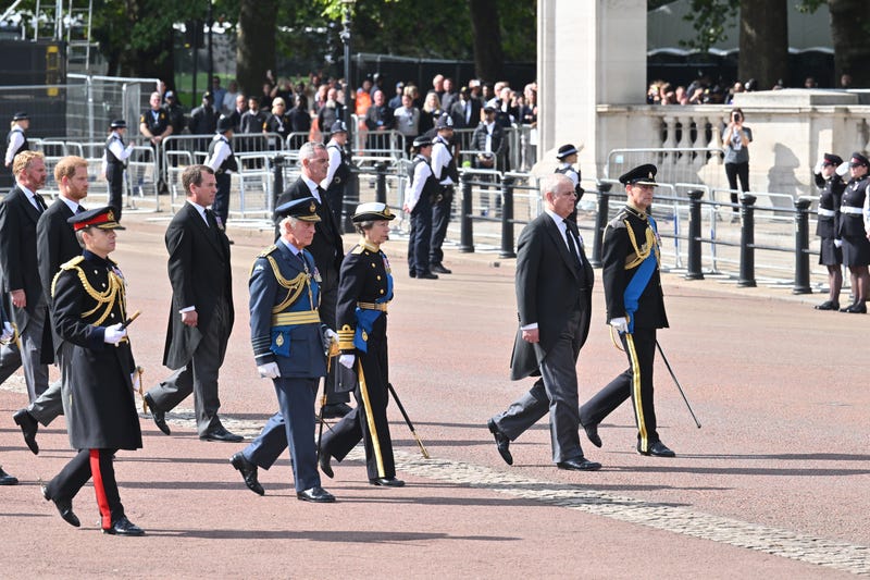 Prince Harry, Duke of Sussex, Mr Peter Phillips, King Charles III, Princess Anne, Princess Royal, Prince Andrew, Duke of York and Prince Edward, Earl of Wessex walk behind the coffin during the procession for the Lying-in State of Queen Elizabeth II on September 14, 2022 in London