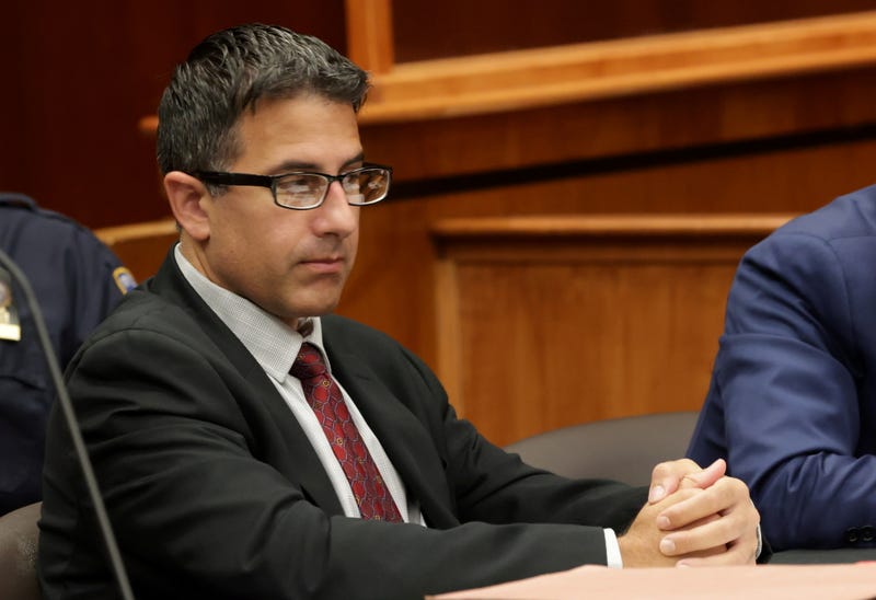 Ex-NYPD officer Michael Valva, sits beside his attorney, John LoTurco, inside Judge William Condon’s courtroom in Suffolk County Supreme Court in Riverhead, New York, on September 12, 2022.
