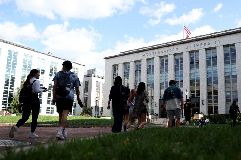 BOSTON, MASSACHUSETTS - SEPTEMBER 14: Students walk Northeastern University campus on September 14, 2022 in Boston, Massachusetts. On Tuesday evening, a university employee was injured when a package sent to the virtual reality lab at Holmes Hall exploded when he opened it.