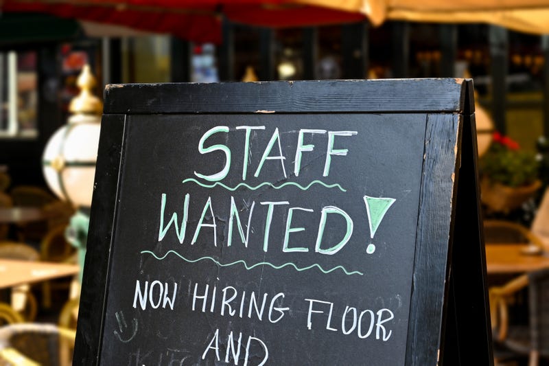Hiring sign outside of an establishment.
