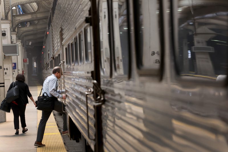 Rider boarding Metra train