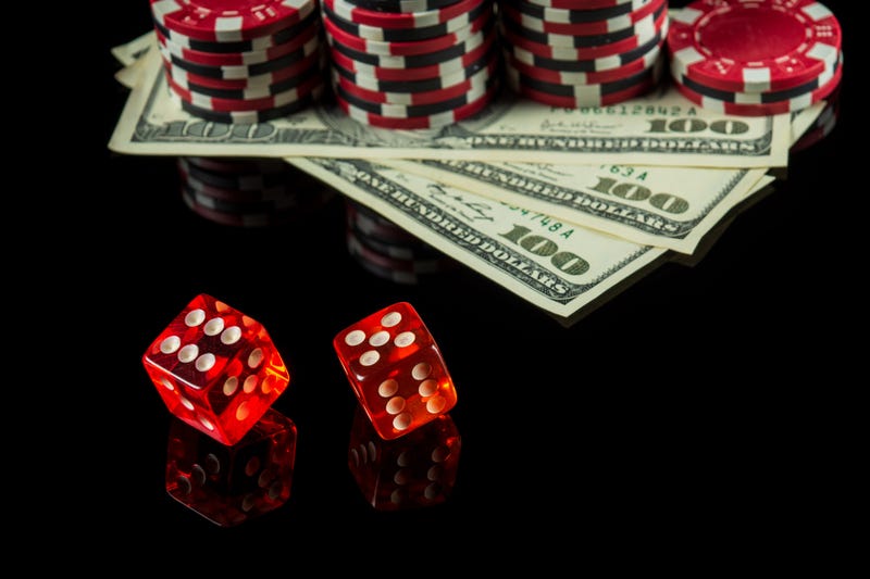 dice and hundred dollar bills