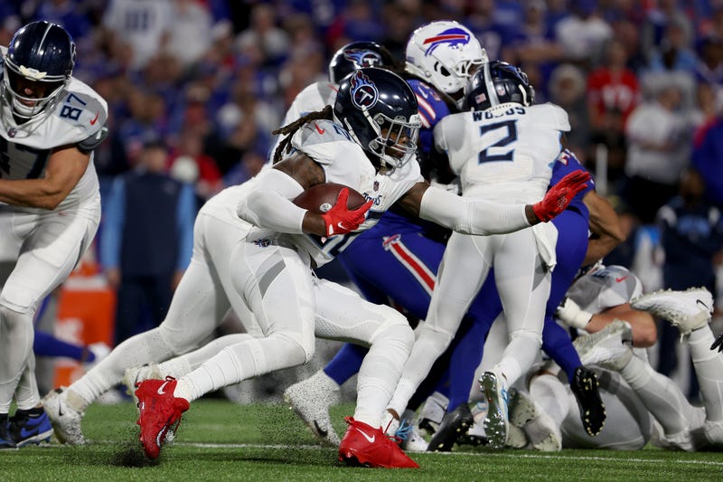 Derrick Henry #22 of the Tennessee Titans runs the ball against the Buffalo Bills during the third quarter of the game at Highmark Stadium on September 19, 2022
