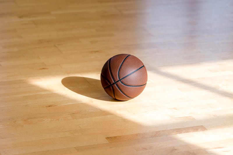 iBasketball court wooden floor with professional brown leather ball and shadows. Horizontal sport poster, greeting cards, headers, website