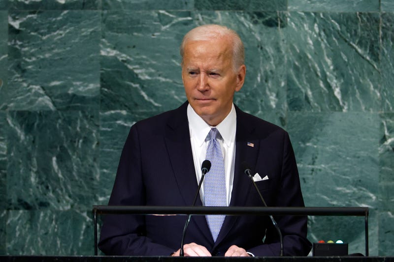 joe biden speaks into a little microphone