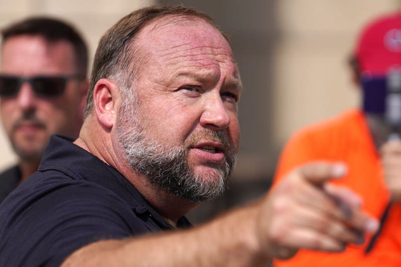 InfoWars founder Alex Jones speaks to the media outside Waterbury Superior Court during his trial on September 21, 2022 in Waterbury, Connecticut. Jones is being sued by several victims' families for causing emotional and psychological harm after they lost their children in the Sandy Hook massacre. A Texas jury last month ordered Jones to pay $49.3 million to the parents of 6-year-old Jesse Lewis, one of 26 students and teachers killed in the shooting in Newtown, Connecticut. (Photo by Joe Buglewicz/Getty Images)