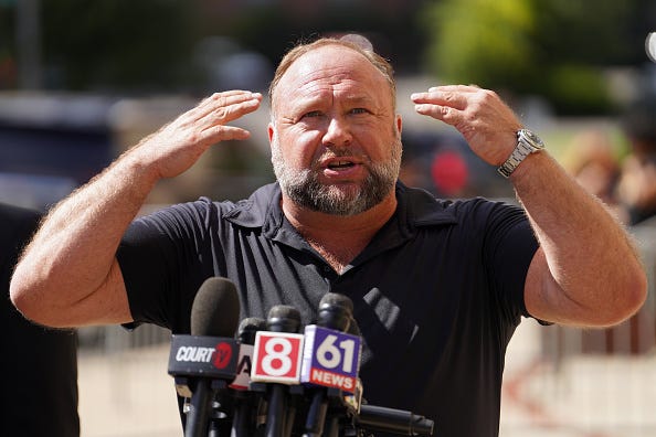 InfoWars founder Alex Jones speaks to the media outside Waterbury Superior Court during his trial on September 21, 2022 in Waterbury, Connecticut. 