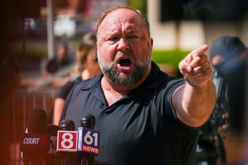 InfoWars founder Alex Jones speaks to the media outside Waterbury Superior Court during his trial on September 21, 2022 in Waterbury, Connecticut. 
