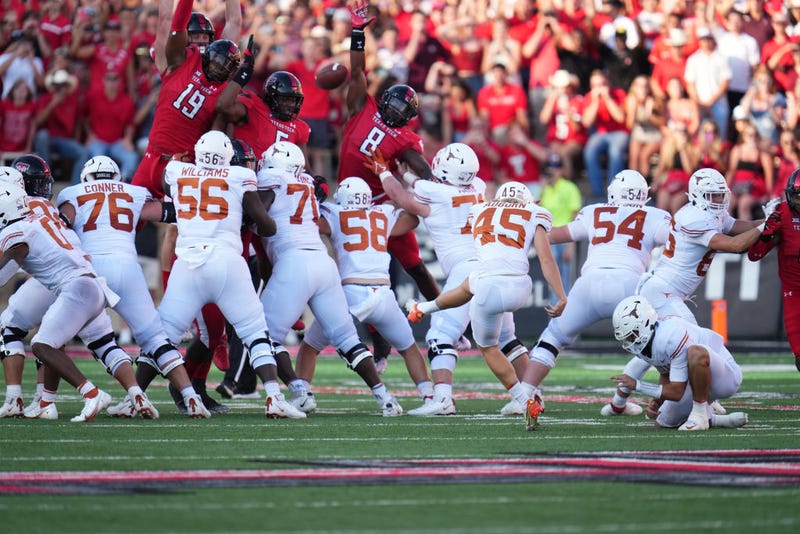 Bert Auburn #45 of the Texas Longhorns kicks a field goal during the second half against the Texas Tech Red Raiders at Jones AT&T Stadium on September 24, 2022 in Lubbock, Texas. 