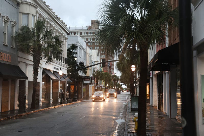 Cars drive through a nearly-deserted historic district as the city prepares for Hurricane Ian to make landfall on September 30, 2022 in Charleston, South Carolina.