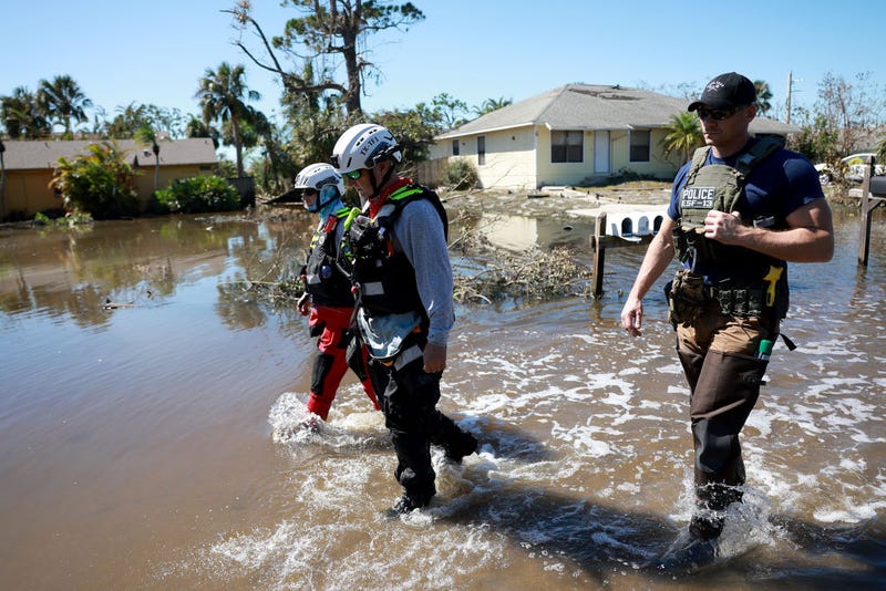 Members of the Texas A&M Task Force 1 Search and Rescue team look for anyone needing help after Hurricane Ian passed through the area on September 30, 2022 in Fort Myers, Florida.