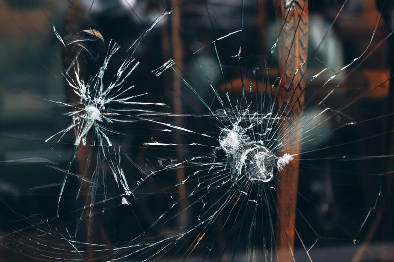 Bullet holes in glass. 
