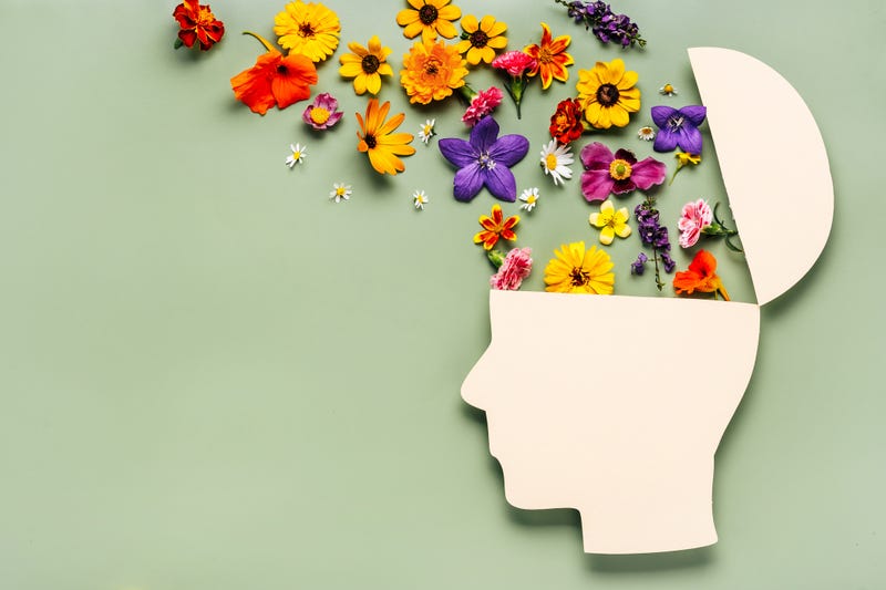 Flowers coming out of a brain.