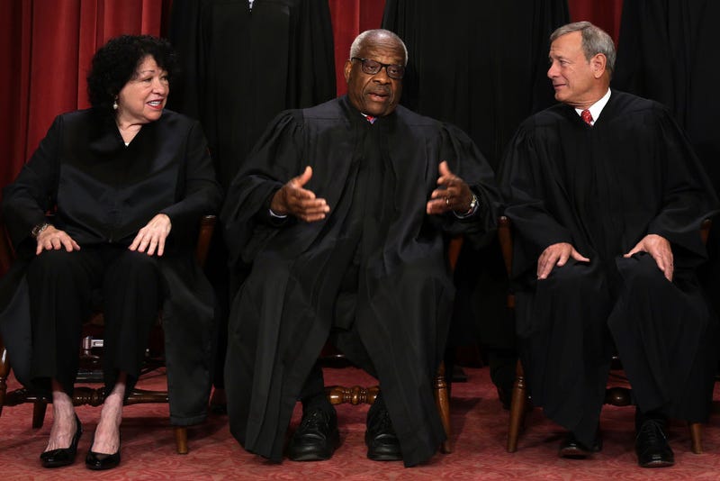 United States Supreme Court (L-R) Associate Justice Sonia Sotomayor, Associate Justice Clarence Thomas, and Chief Justice of the United States John Roberts pose for their official portrait at the East Conference Room of the Supreme Court building on October 7, 2022 in Washington, DC. The Supreme Court has begun a new term after Associate Justice Ketanji Brown Jackson was officially added to the bench in September. 