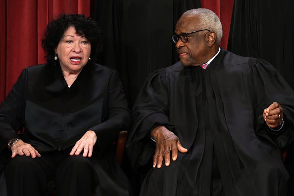 United States Supreme Court Associate Justice Sonia Sotomayor (L) and Associate Justice Clarence Thomas (R) pose for their official portrait at the East Conference Room of the Supreme Court building on October 7, 2022 in Washington, DC. 