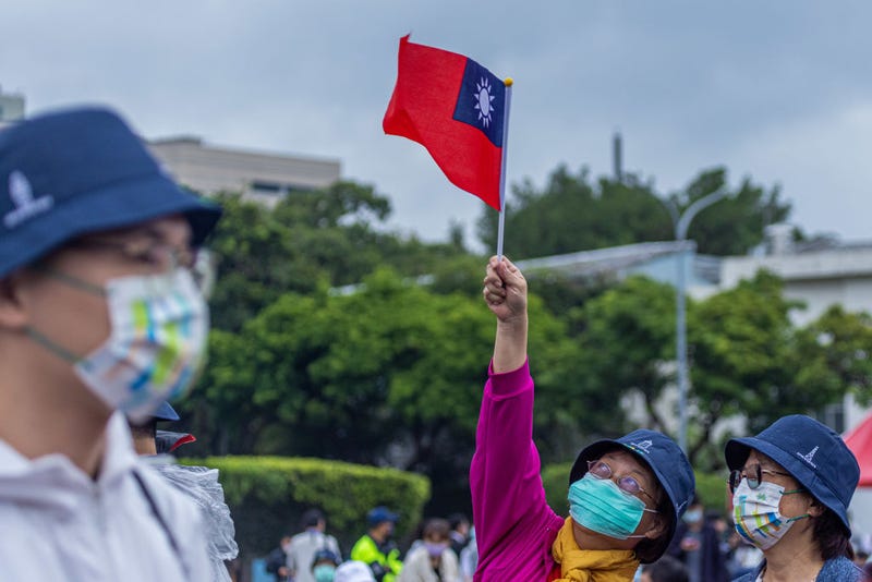 A woman holds a Taiwanese flag on the Taiwan's National Day on October 10, 2022 in Taipei, Taiwan.