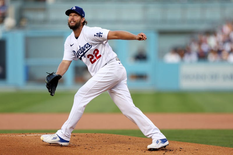  Clayton Kershaw #22 of the Los Angeles Dodgers reacts after giving up a home run to Manny Machado #13 of the San Diego Padres in the first inning in game two of the National League Division Series at Dodger Stadium on October 12, 2022 in Los Angeles, California. 