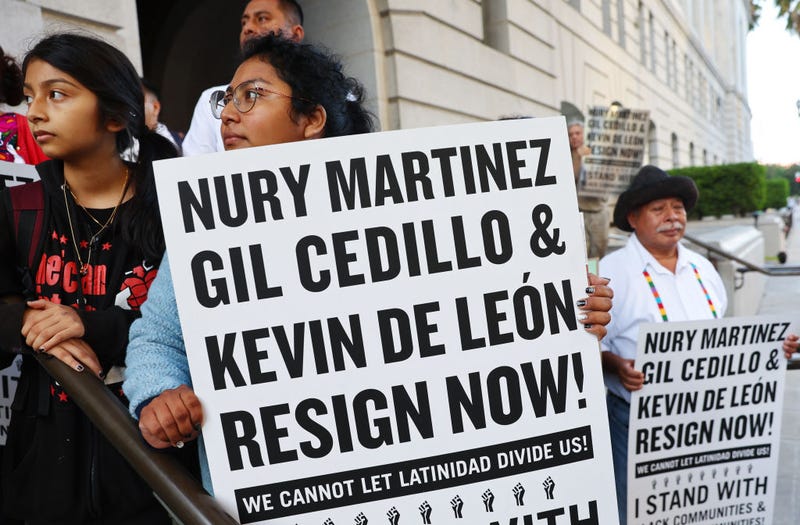 Protestors demonstrate outside City Hall calling for the resignations of L.A. City Council members Kevin de Leon and Gil Cedillo in the wake of a leaked audio recording on October 12, 2022 in Los Angeles, California.
