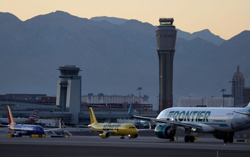 A Frontier Airlines plane prepare to take off from Harry Reid International Airport as Southwest Airlines and Spirit Airlines planes taxi on October 14, 2022 in Las Vegas, Nevada. 