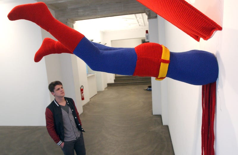 Superman stuck in a wall